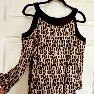 Leopard print pull over cold-shoulder top with solid brown trim.